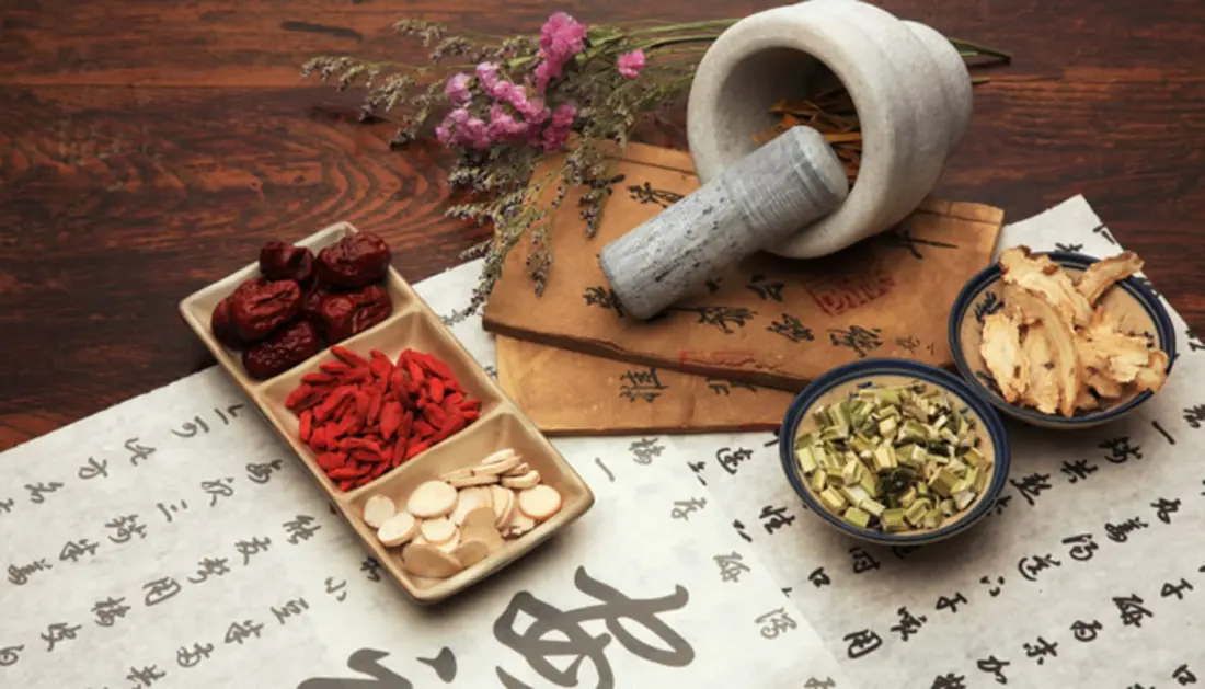 Traditional Chinese herbs with mortar and pestle
